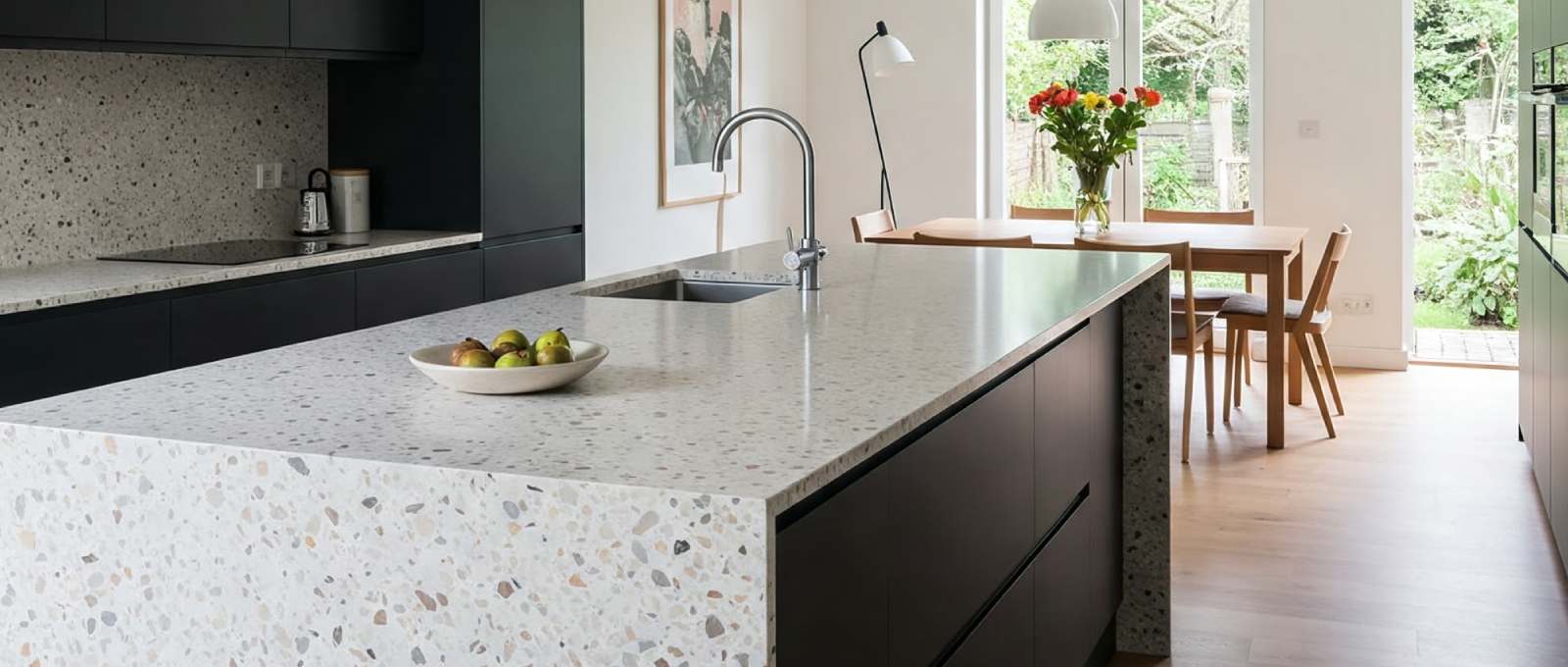 A modern kitchen with a terrazzo countertop.