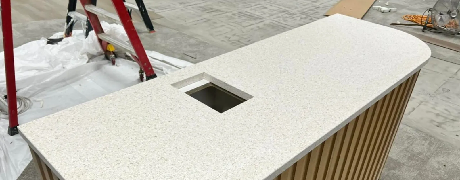YDL stone benchtop with integrated sink cutout in a modern kitchen or bar area.