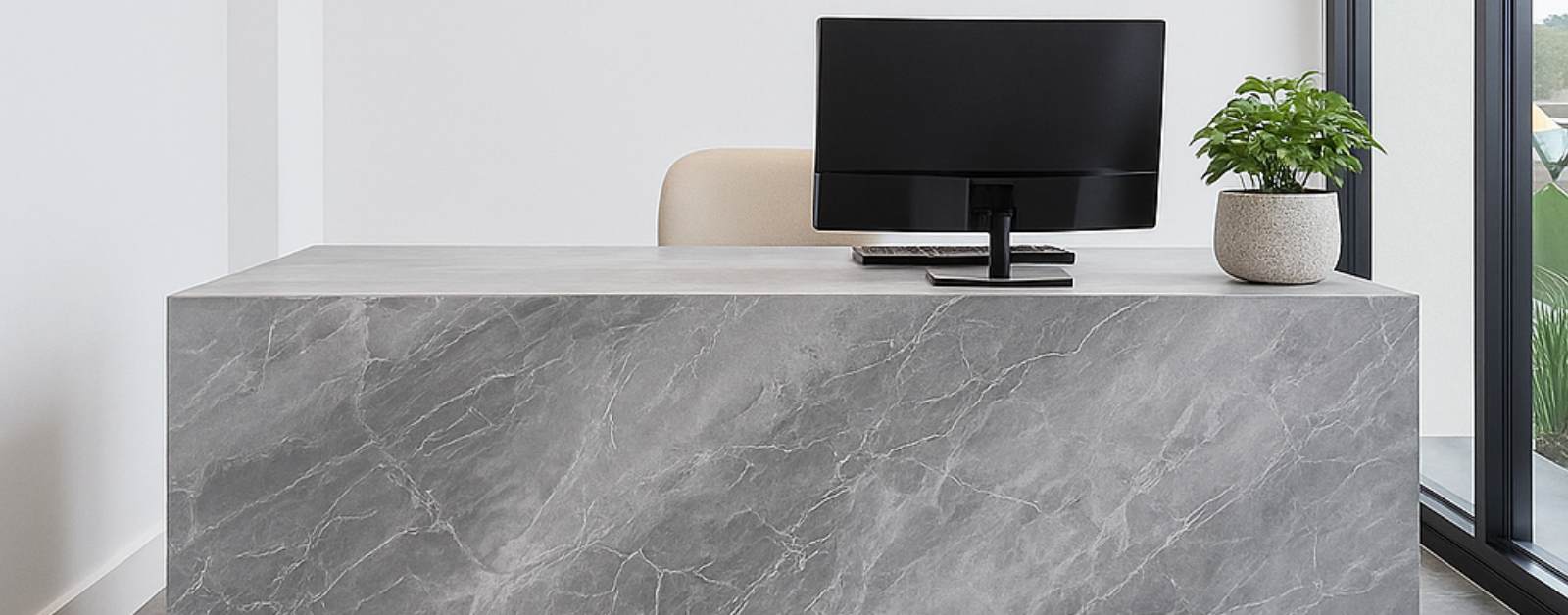Contemporary commercial space in Cebu featuring a sleek grey marble reception desk